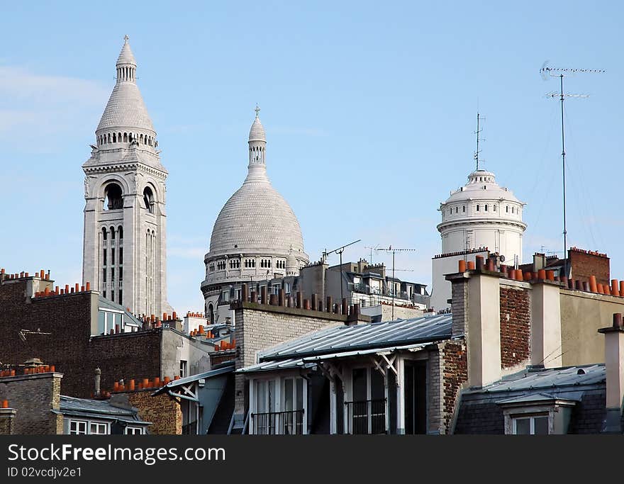 Montmartre - famous Paris district on top view with roofs, chimneys, towers and Basilica Sacre Couer, France