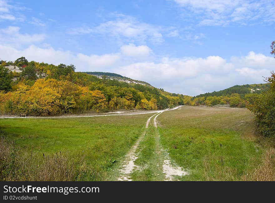 The road stretches into the distance. Backpacking