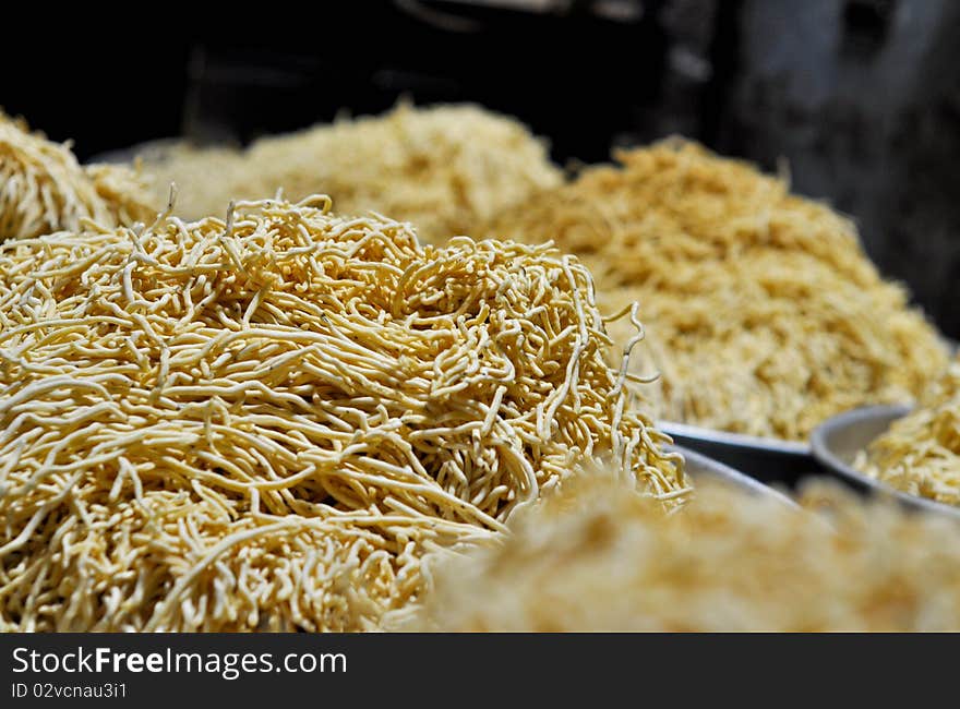 Bhujia Sev. A very famous snack from northern India. A paste of gram flour is fried in hot oil through a sieve.