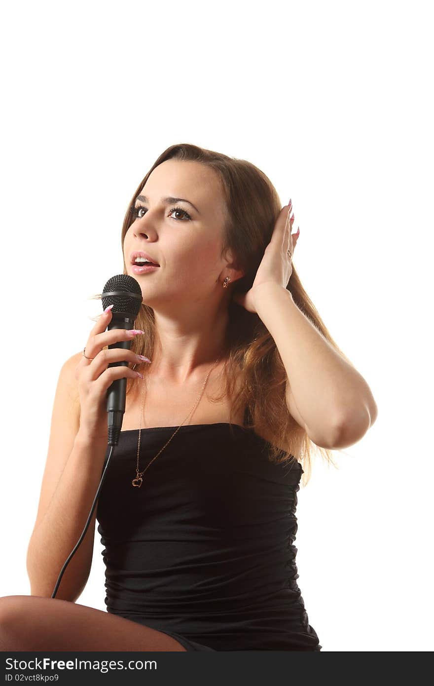 Young attractive girl on the white isolated background was singing. Young attractive girl on the white isolated background was singing.