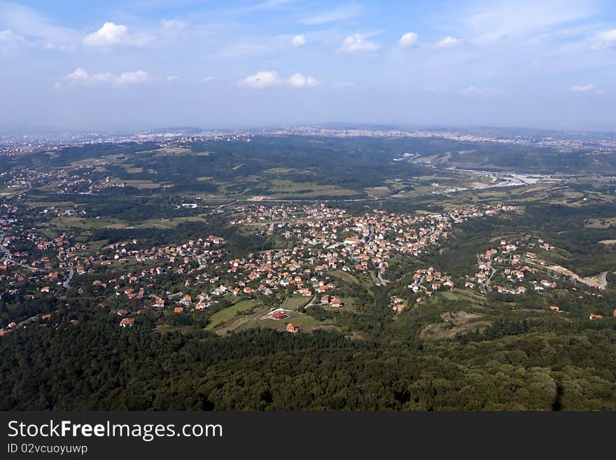 A Panoramic shot of old  town Belgrade and Forest in the Foreground.