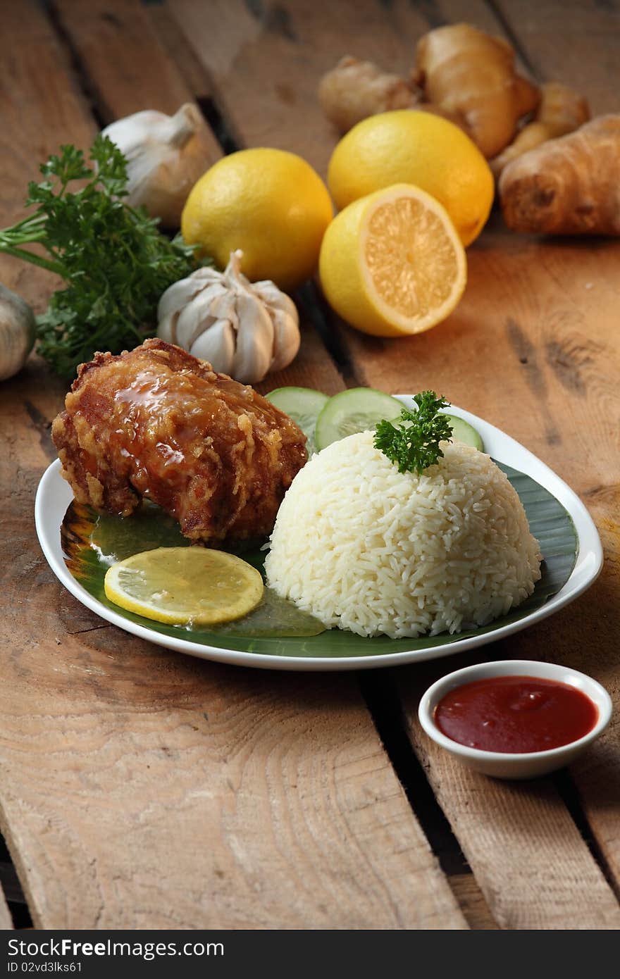 Deep fried chicken rice with ingredient background. Deep fried chicken rice with ingredient background