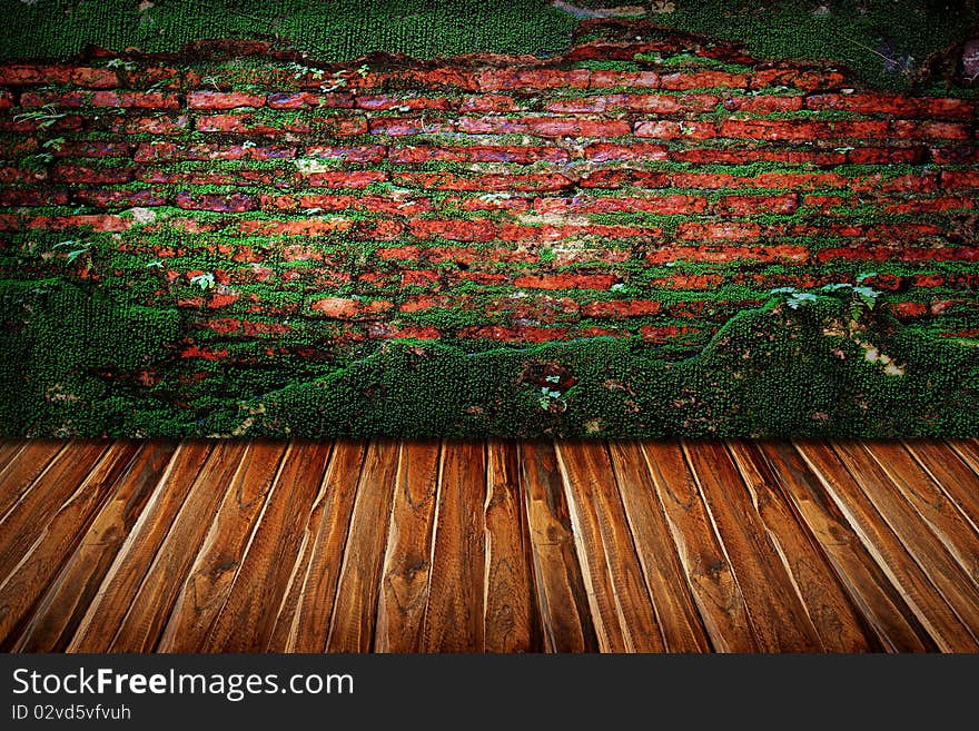 Texture of old stone wall covered green moss