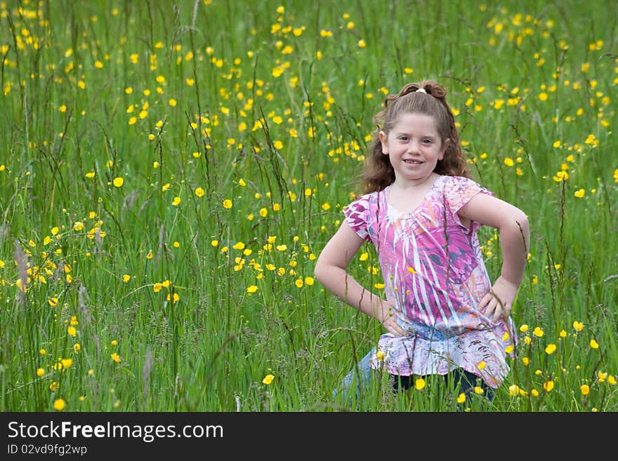 Beautiful young girl in a field of yellow flowers. Beautiful young girl in a field of yellow flowers