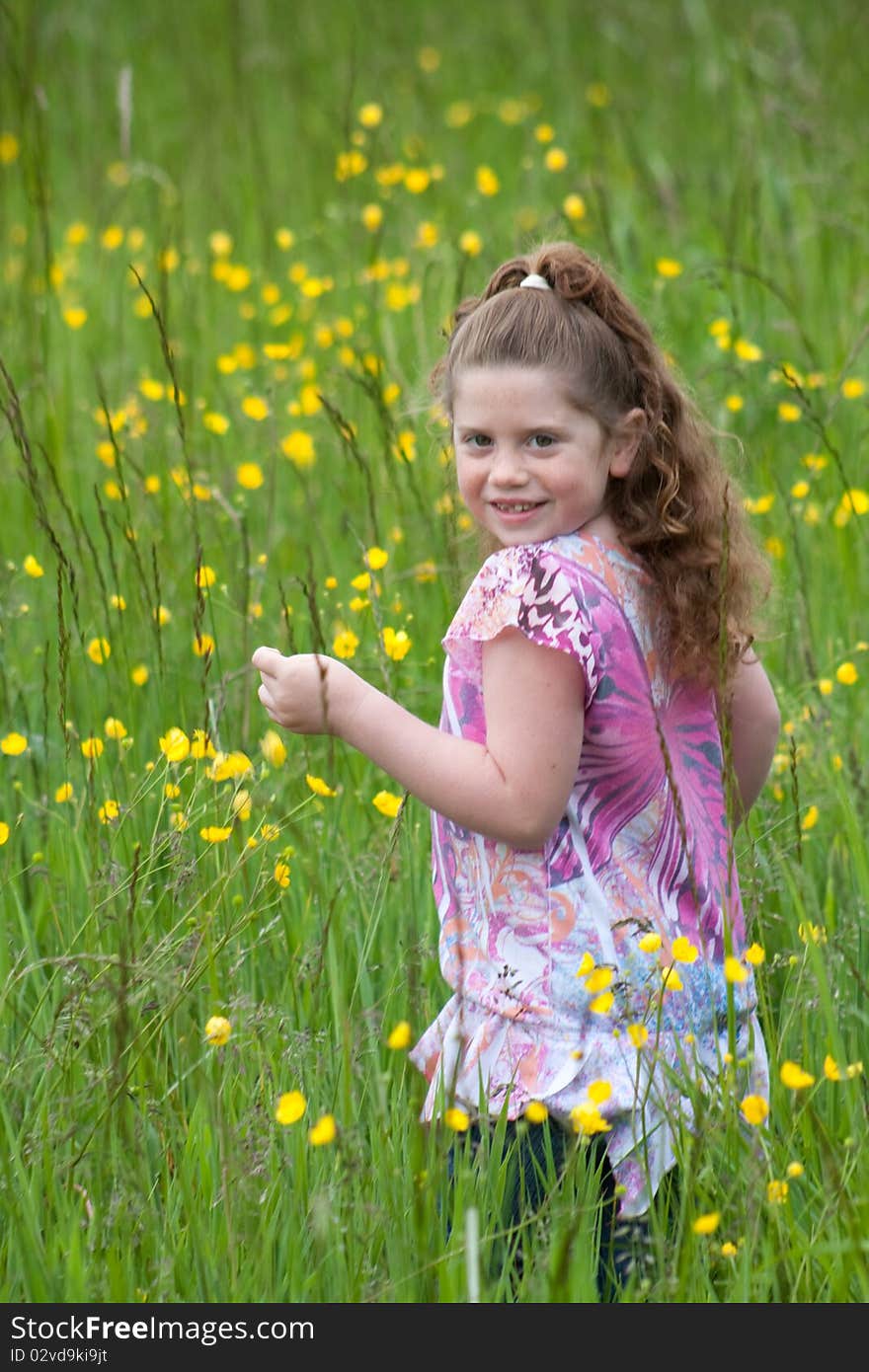 Beautiful young girl in a field of yellow flowers. Beautiful young girl in a field of yellow flowers