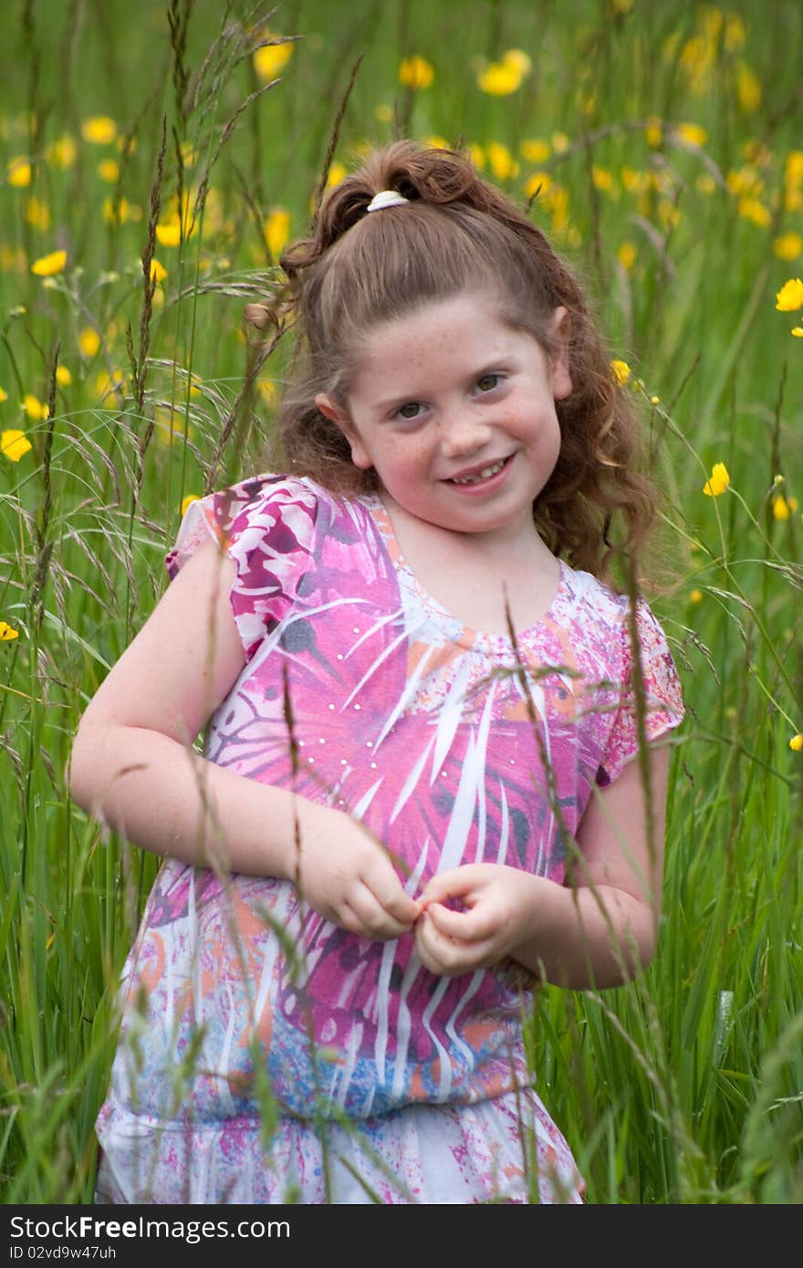 Beautiful young girl in a field of yellow flowers. Beautiful young girl in a field of yellow flowers