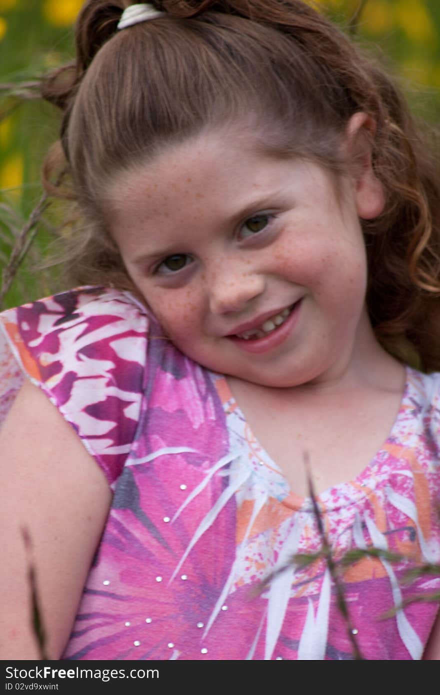 Beautiful young girl in a field of yellow flowers. Beautiful young girl in a field of yellow flowers