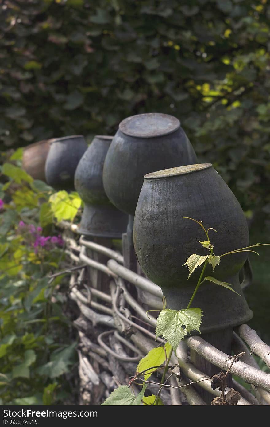 Ceramic pots on the wicker fence