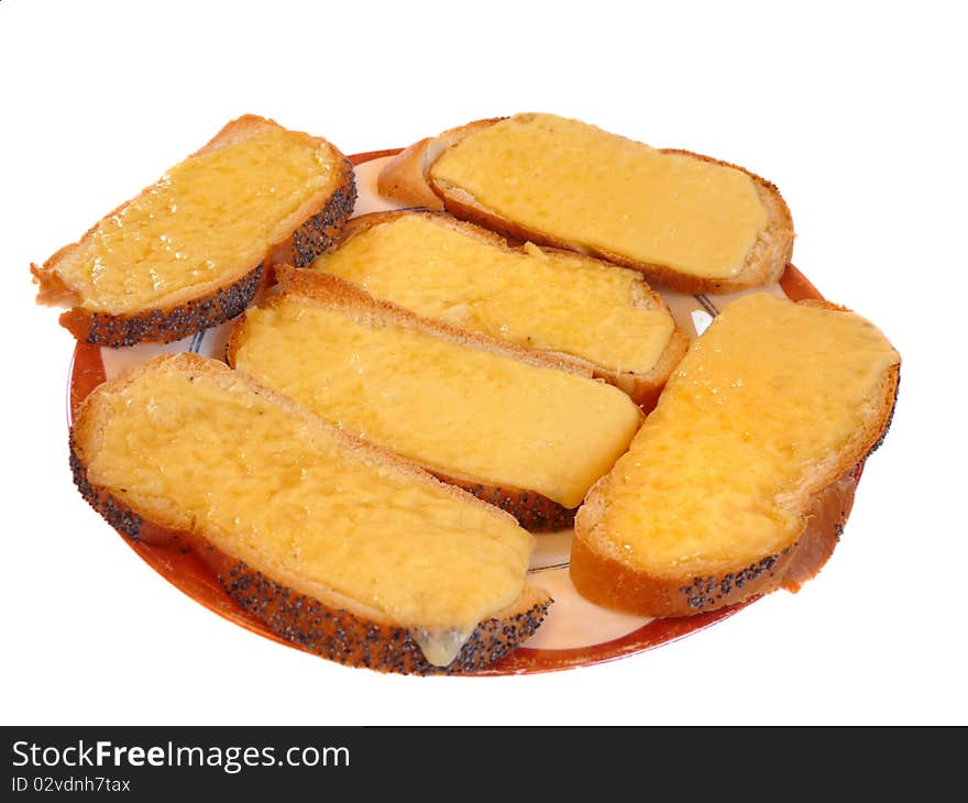 Toast with melted cheese on white.