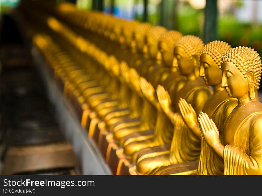 View of buddha statue in gold paint