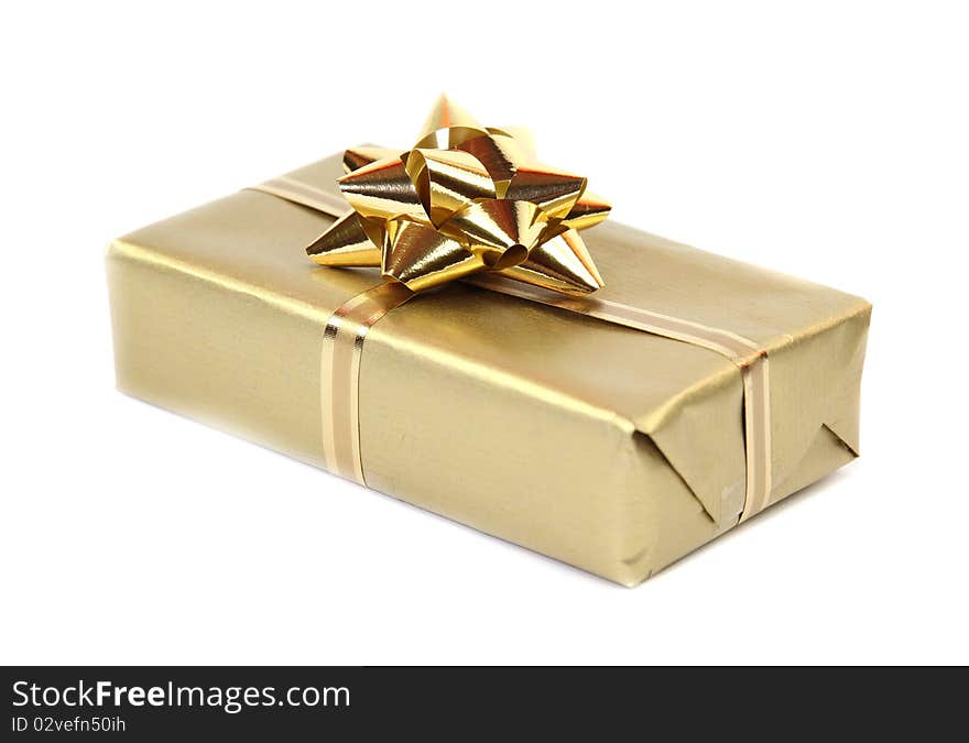 Studio photo of isolated gold gift on white background. Studio photo of isolated gold gift on white background