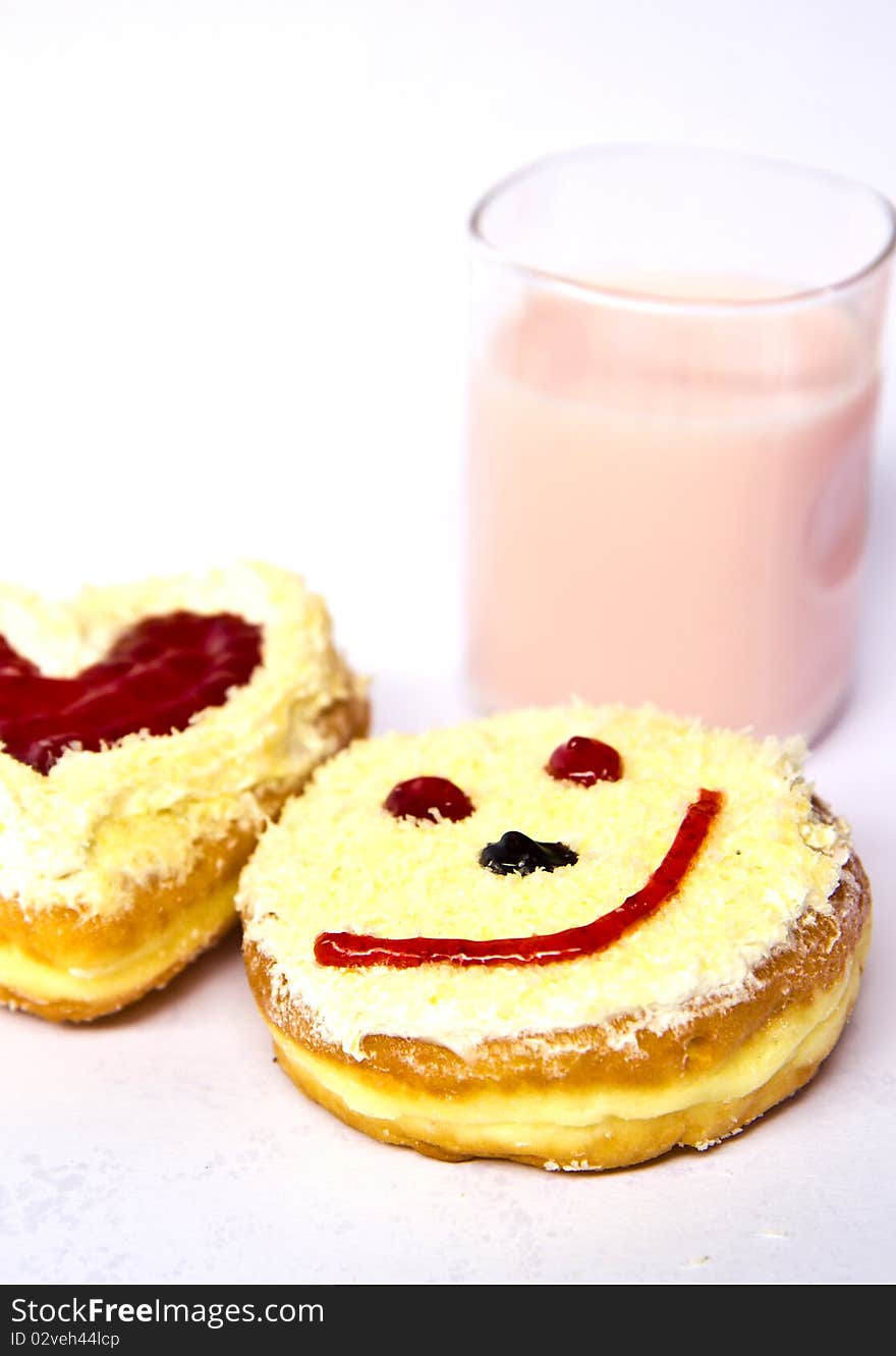 The bread smiles with milk on white background ,. The bread smiles with milk on white background ,