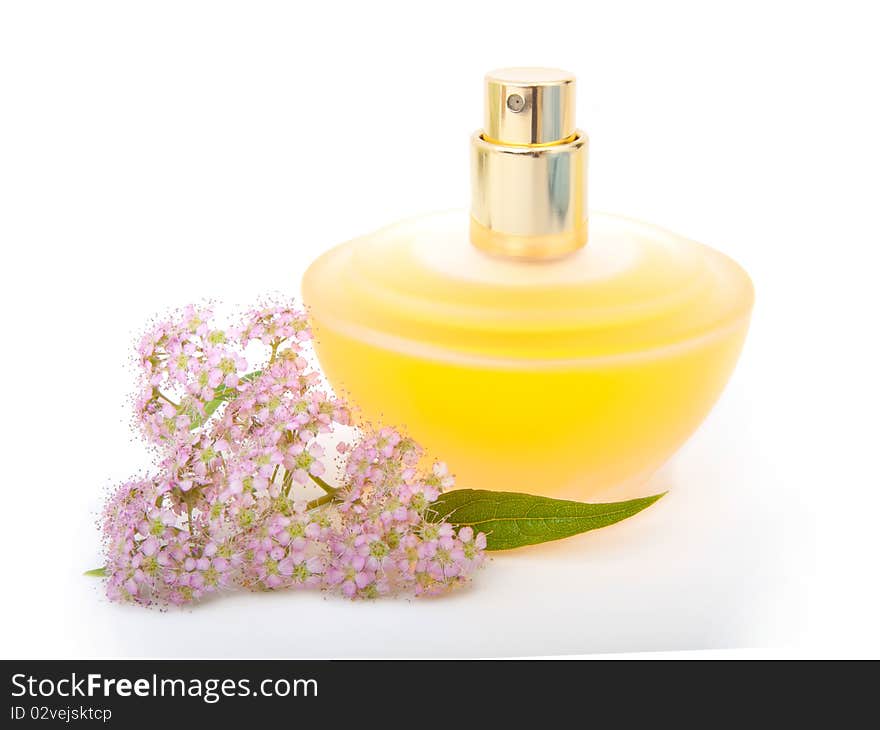 Yellow beautiful bottle of perfume with flowers