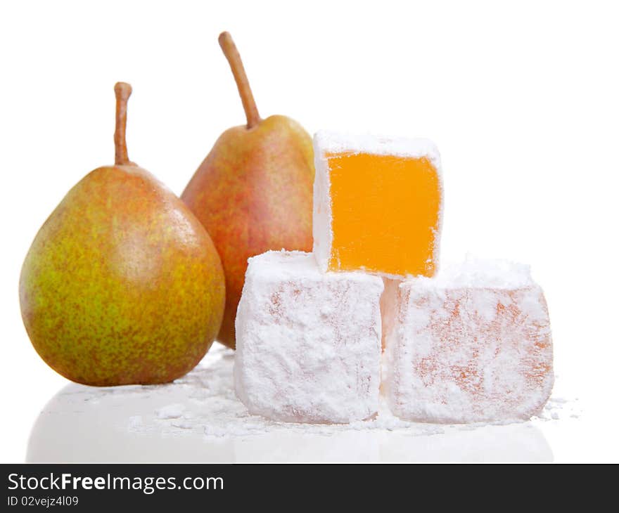 Isolated close up of a stack of turkish delight with two pear