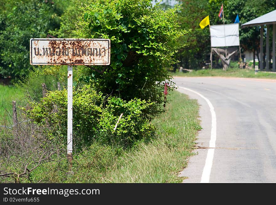 Rusty Road Sign In Rural Thailand