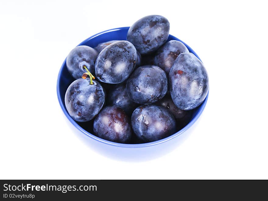 dark blue plums in the bowl