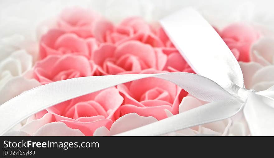 Rose flowers pink and white made of soap isolated on white. Rose flowers pink and white made of soap isolated on white