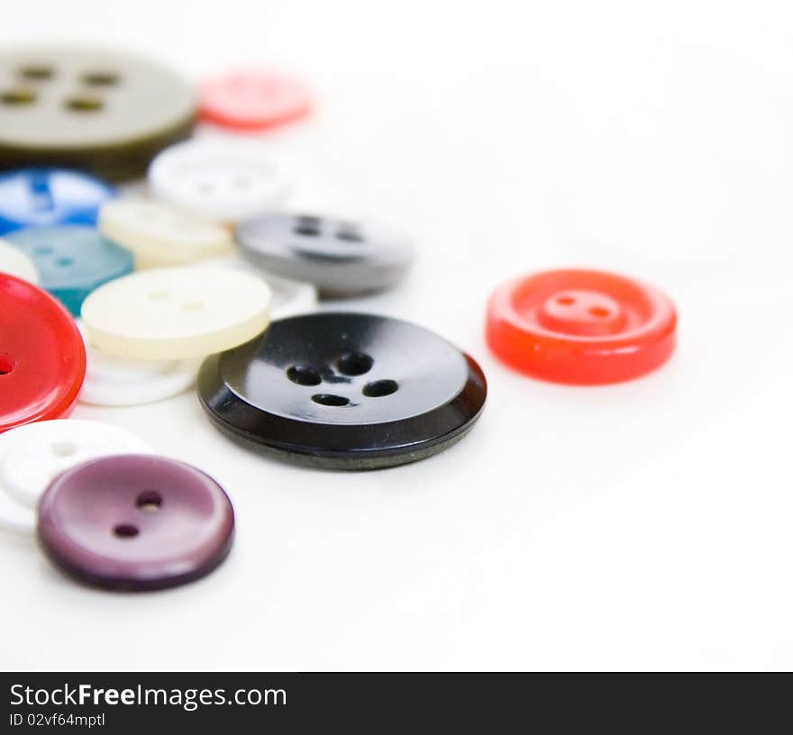 Colorful vintage sewing buttons on white