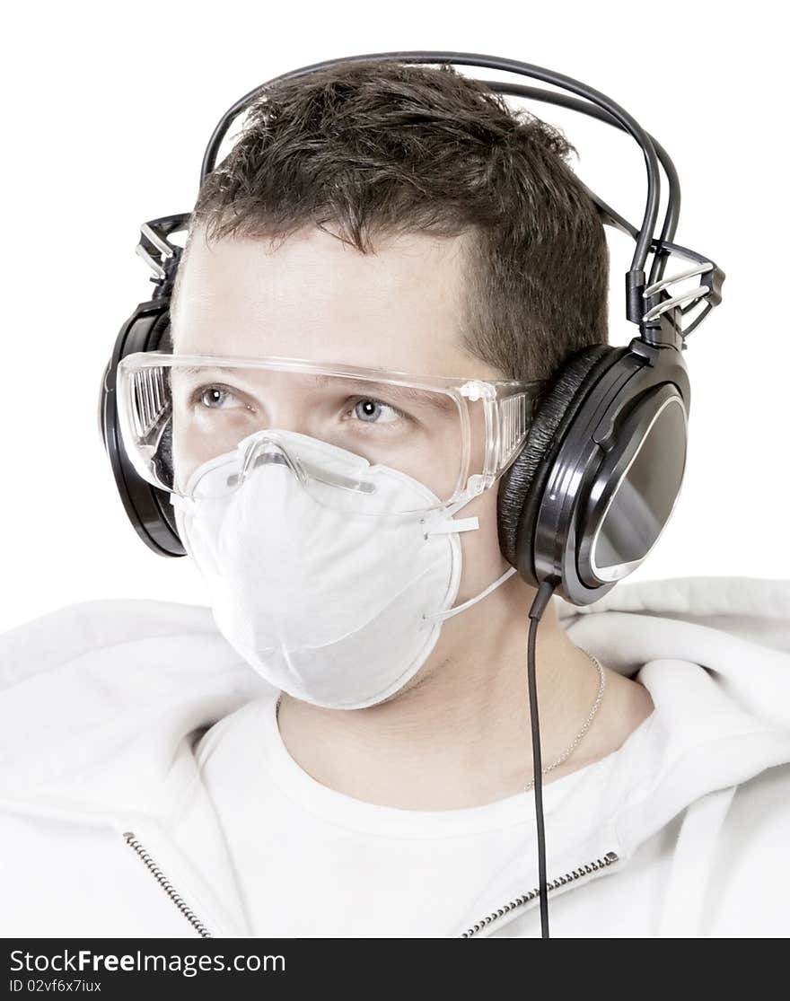 Portrait of man in mask with headphones