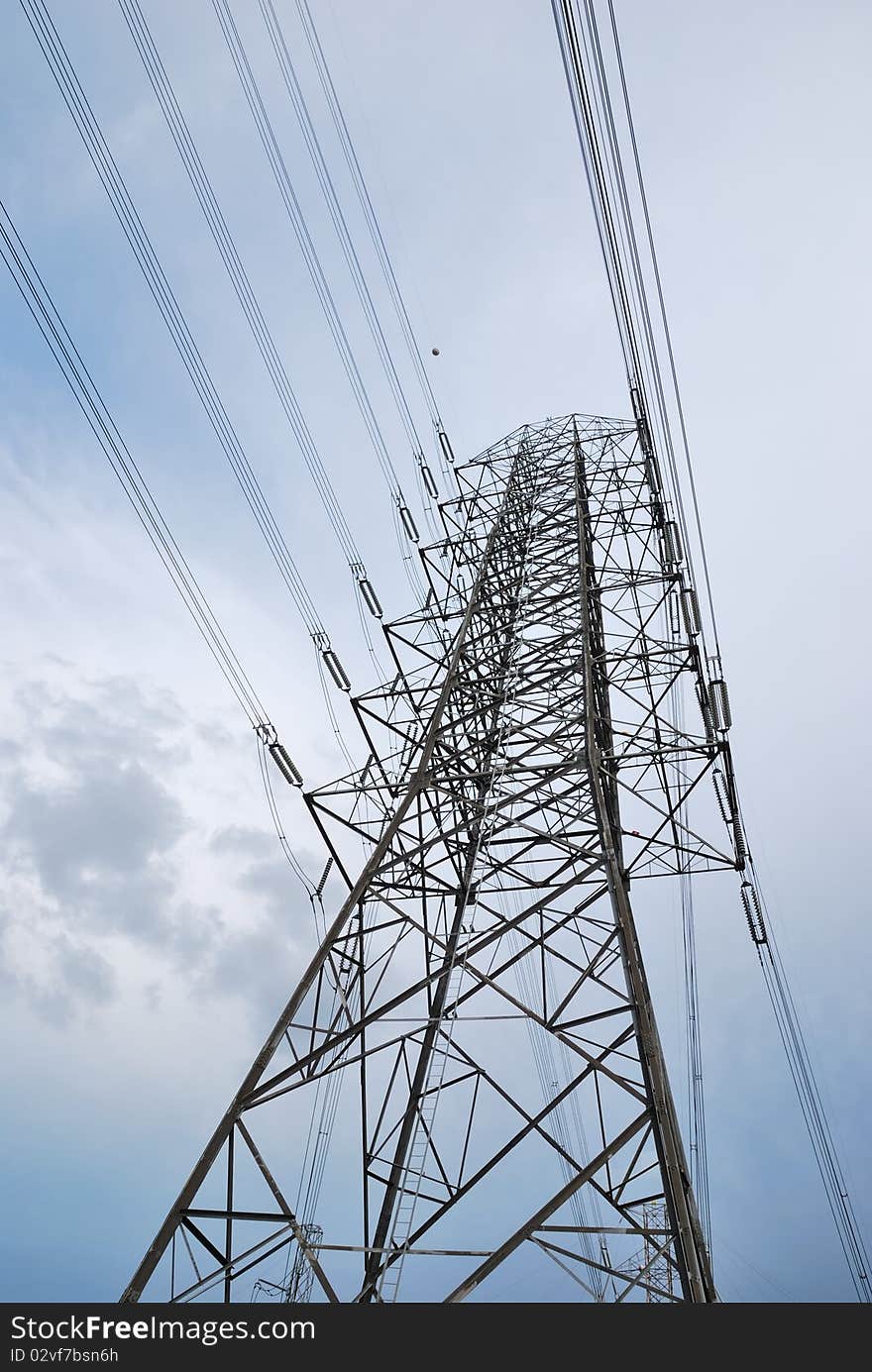 Electric high voltage post with the sky background