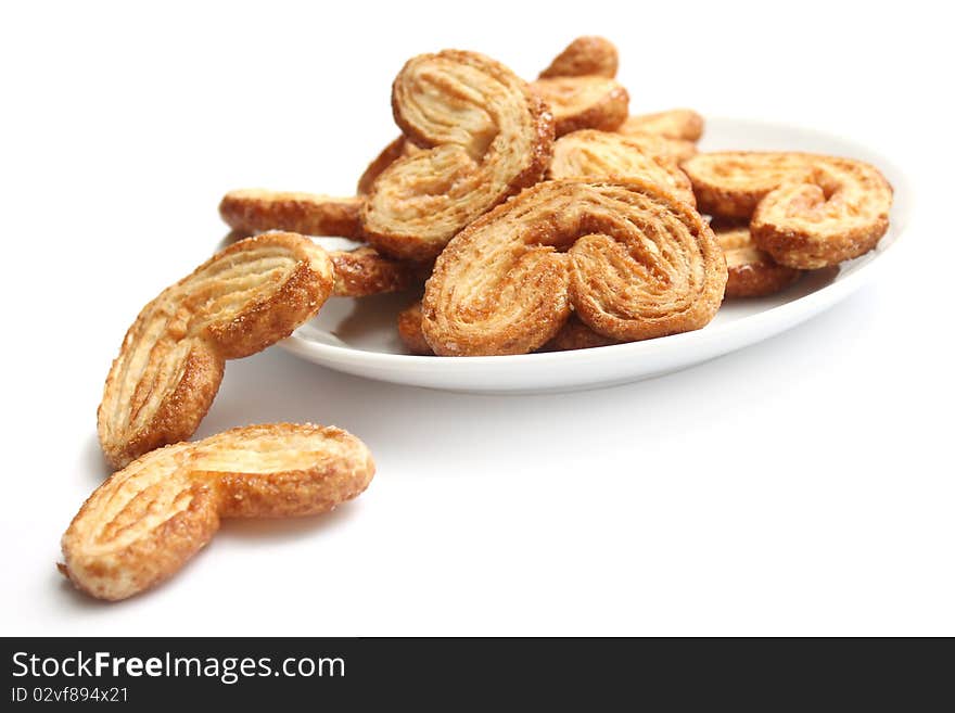 Dutch cookie on white plate over white