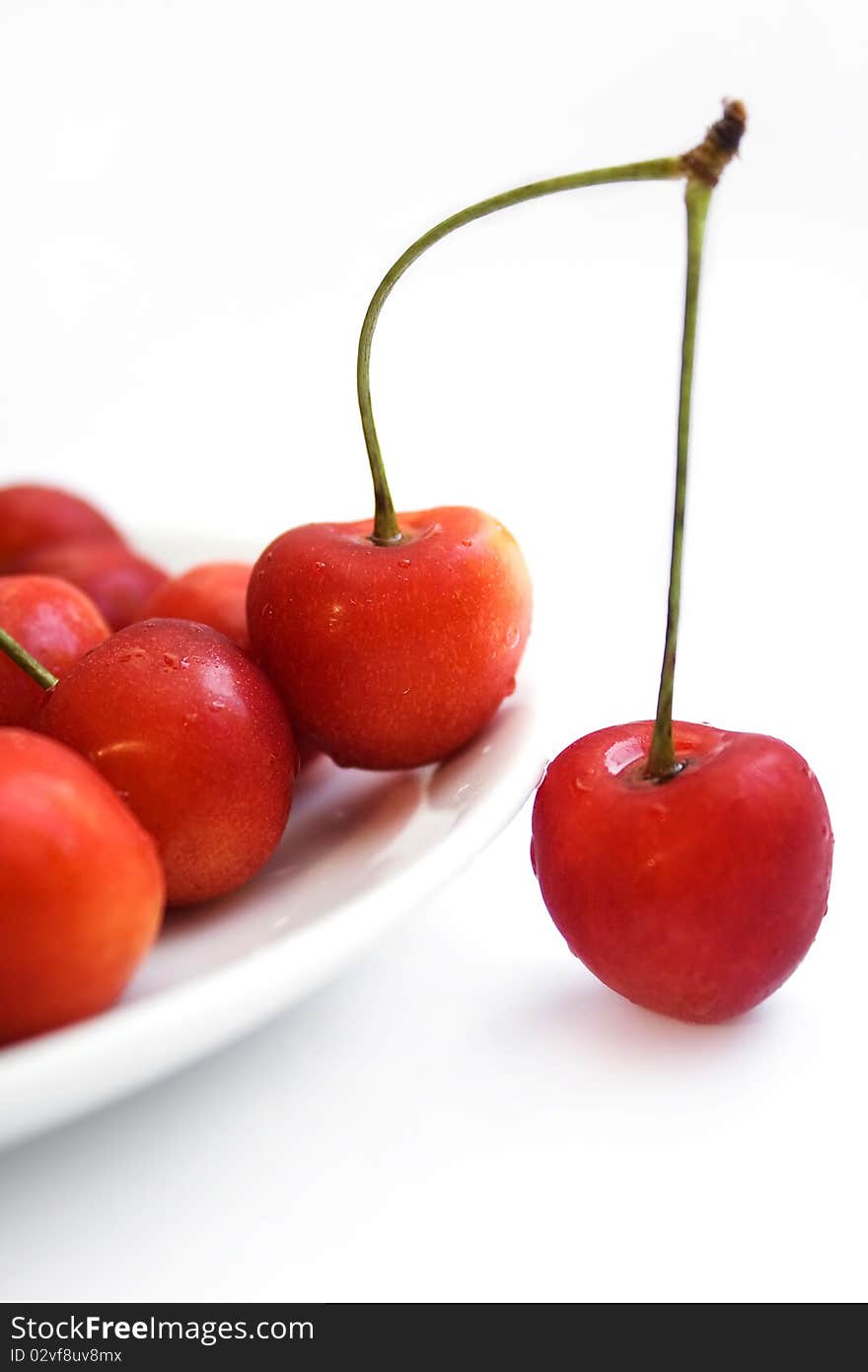 Cherries In White Plate Over White