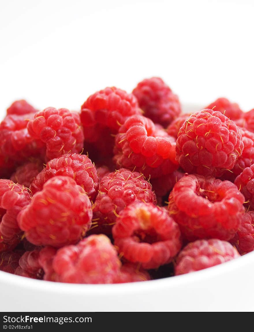 Fresh raspberries on white background