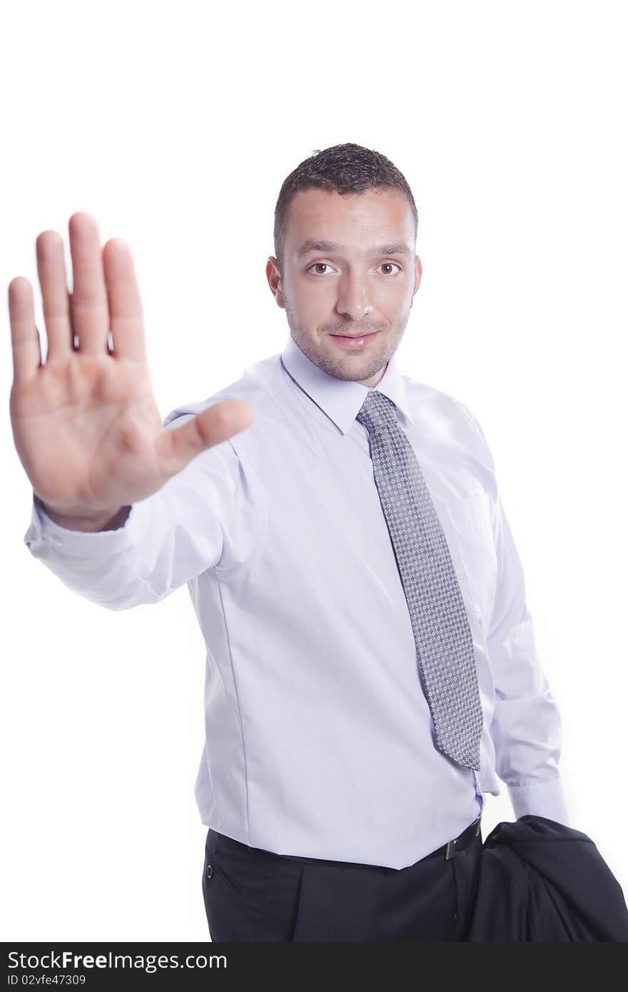 Young businessman shows stop sign by his right hand