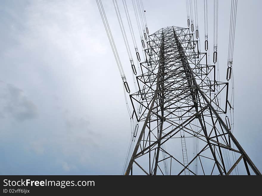 Electric high voltage post with the sky background