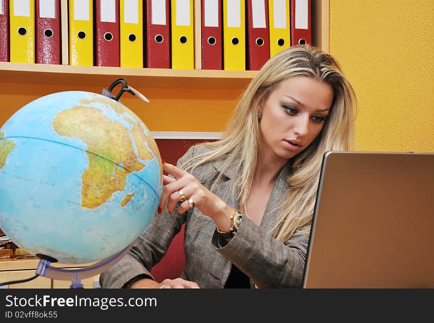 Business woman, computer and globe