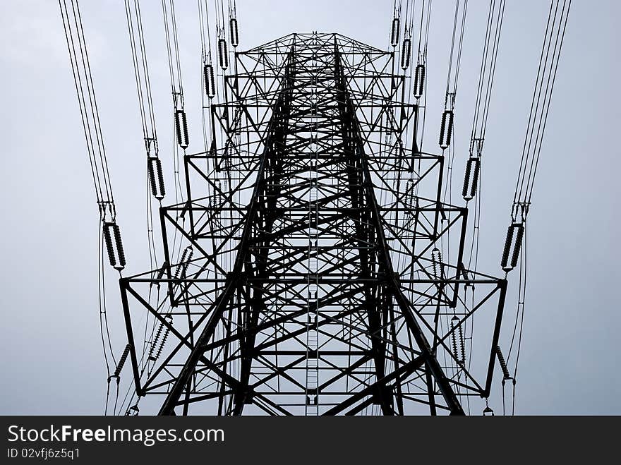 Electric high voltage post with sky background