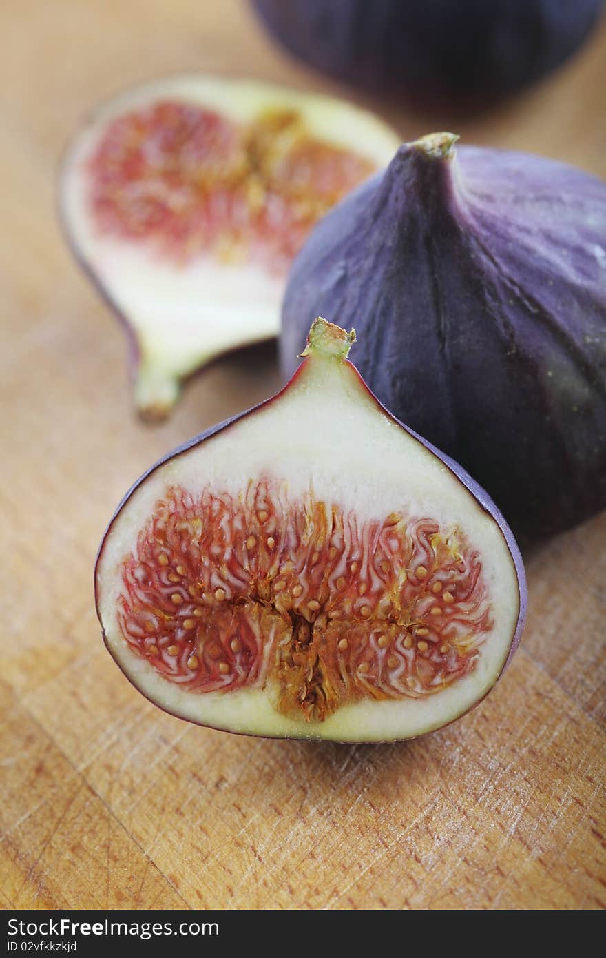 Fresh figs on the wooden background