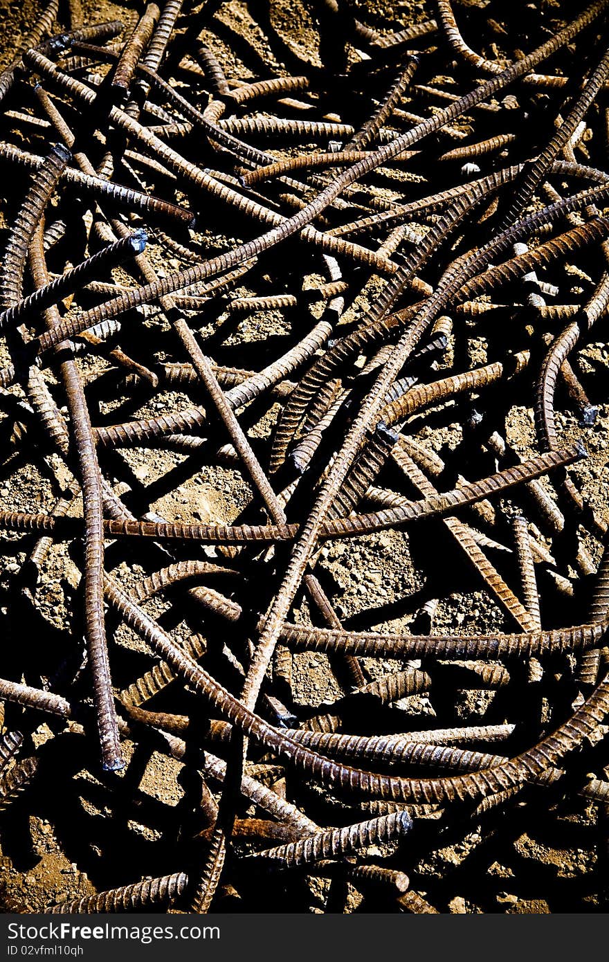 A pile of twisted rebar lays on the ground. A pile of twisted rebar lays on the ground