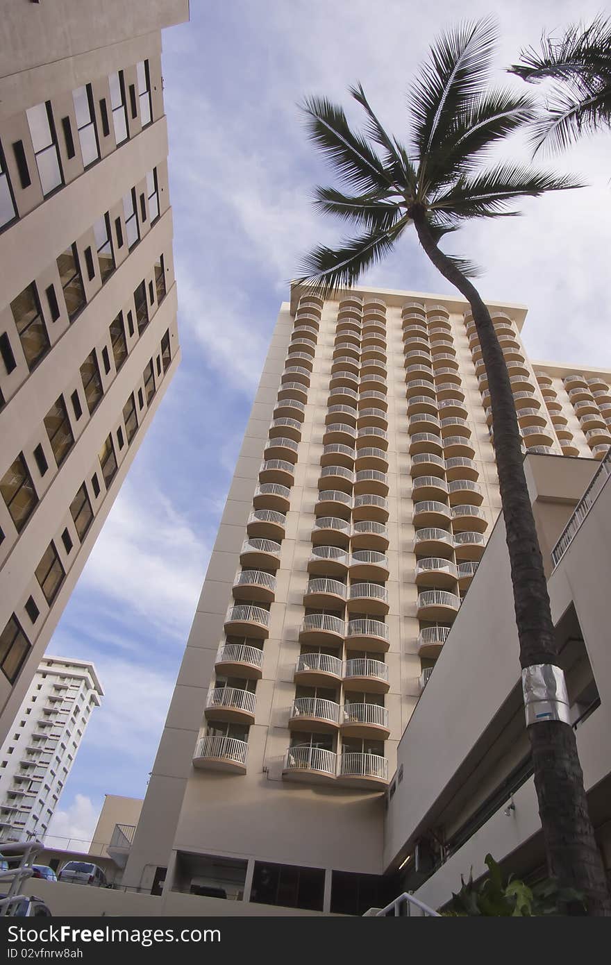 High rise buildings with cloudy sky in background. High rise buildings with cloudy sky in background.