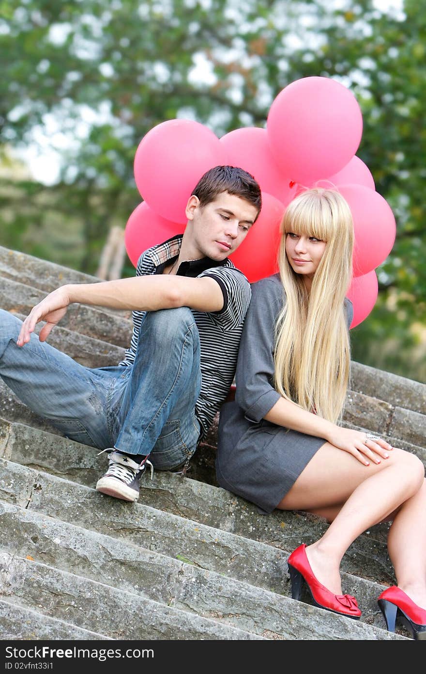 Young loving couple on natural background. Young loving couple on natural background