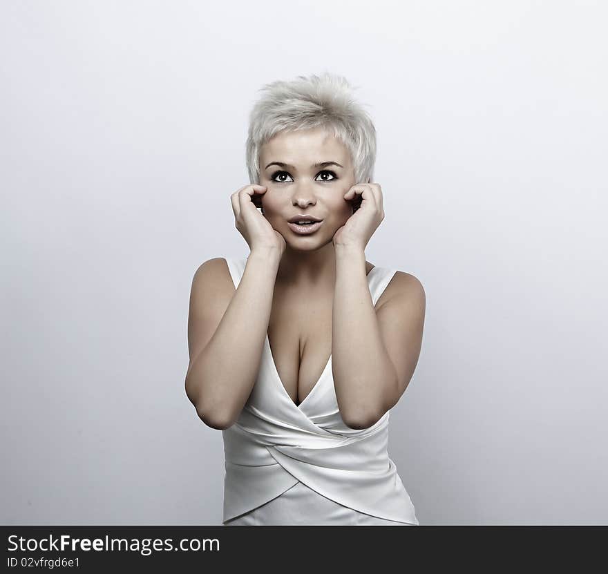 Portrait of an attractive teenage girl on grey background