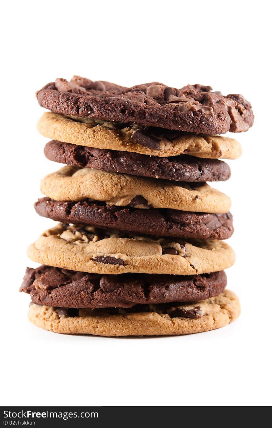 Stack of mixed double chocolate and chocolate chip cookies against a white isolated background. Stack of mixed double chocolate and chocolate chip cookies against a white isolated background.