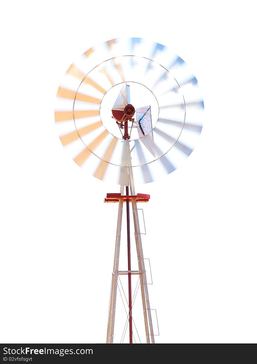 Surrealistic windmill photographed in a pasture in Ramona, CA, USA.  Not Photoshopped, overexposed +2 in camera for affect