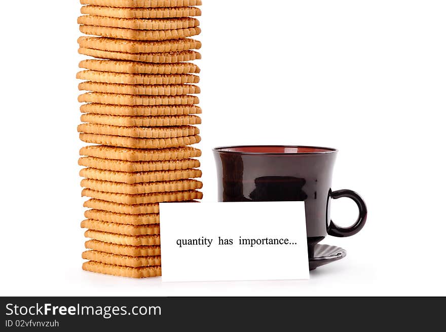 A cup of coffee with a mountain of cookies and a note quantity  has  importance on a white background. A cup of coffee with a mountain of cookies and a note quantity  has  importance on a white background