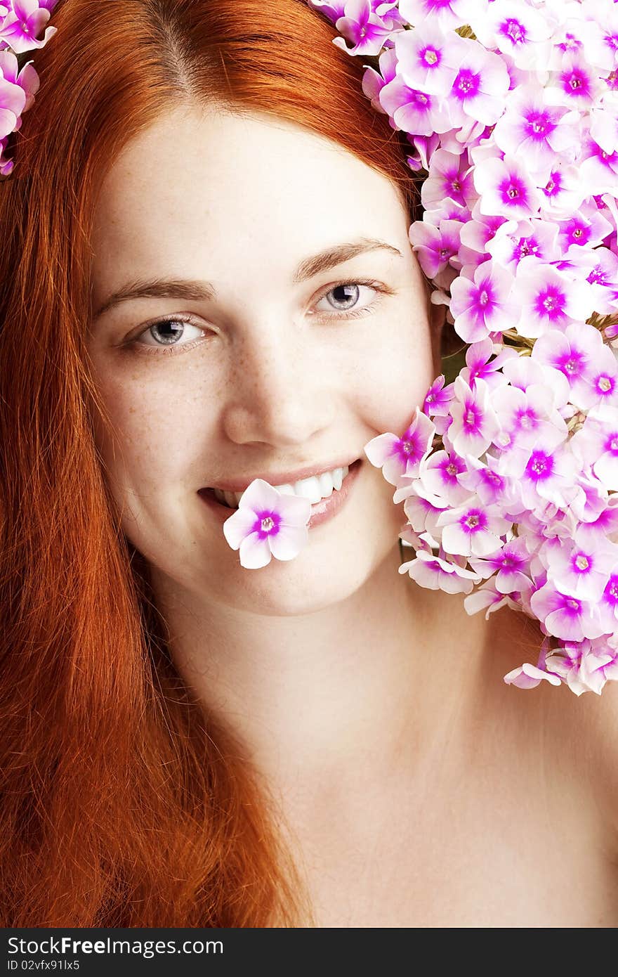 Beautiful girl with flowers in her hair