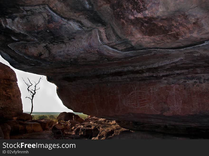 Ancient aboriginal art adorns a spectacular coloured rockface overlooking the wetlands at Ubirr, Kakadu National Park, Northern Terrritory, Australia. Ancient aboriginal art adorns a spectacular coloured rockface overlooking the wetlands at Ubirr, Kakadu National Park, Northern Terrritory, Australia