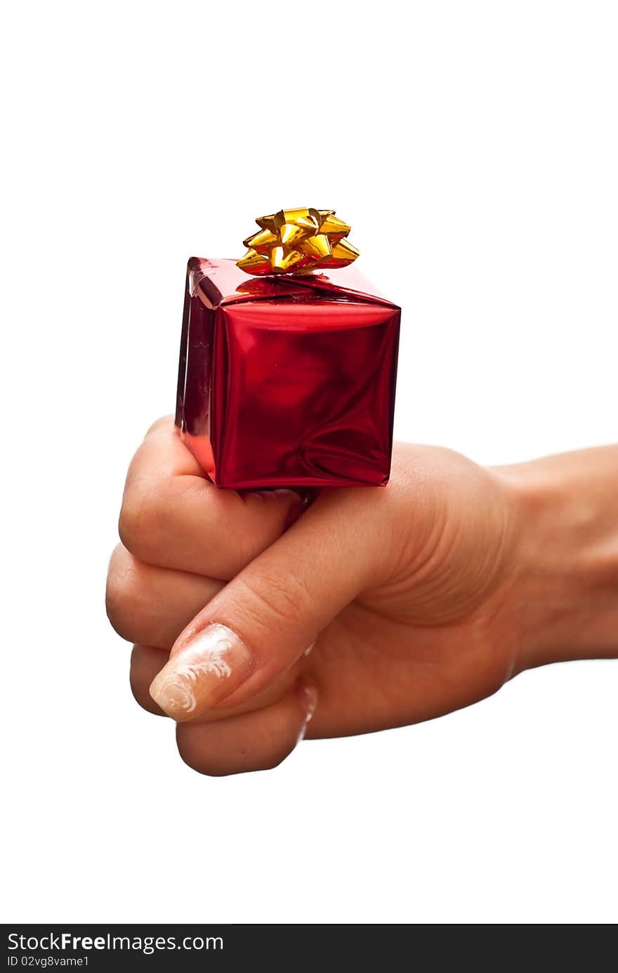 Hand with a small red gift box on it. isolated on white background. Hand with a small red gift box on it. isolated on white background