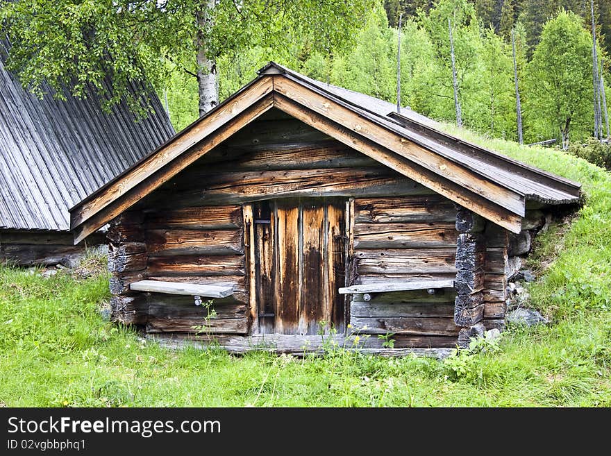 Traditional Wooden Cabin In Sweden