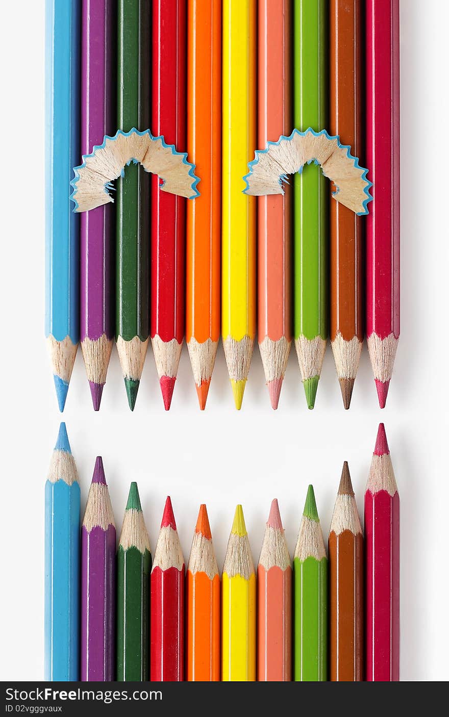 Color pencils formation that looks like smiling expression. Color pencils formation that looks like smiling expression