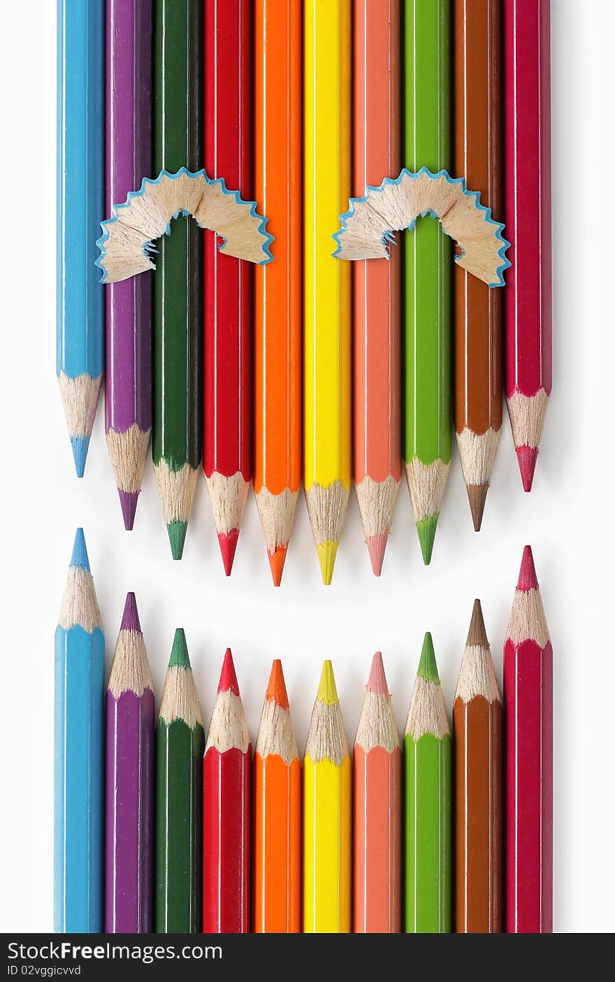 Color pencils formation that looks like smiling expression. Color pencils formation that looks like smiling expression