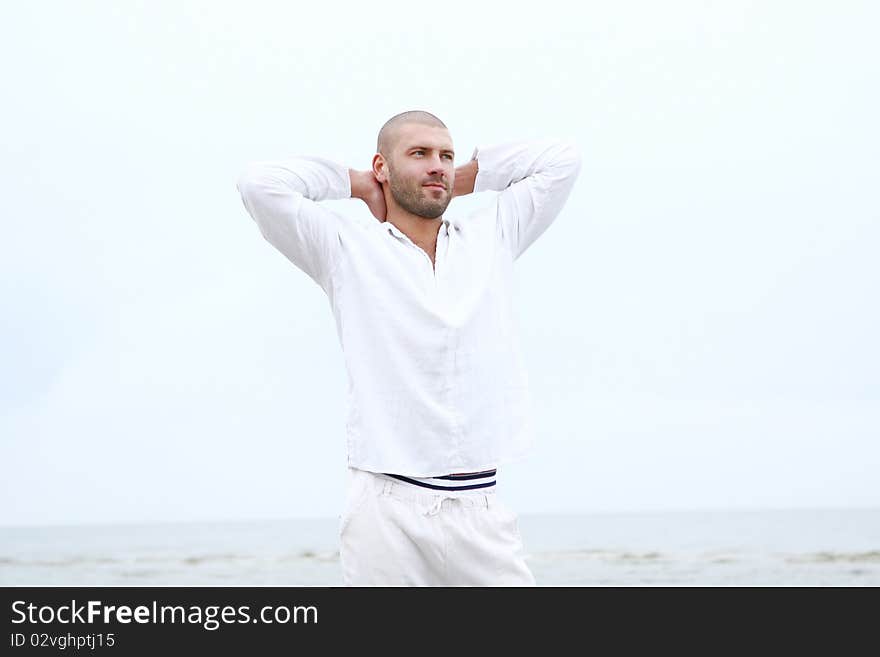 Attractive and happy man on beach