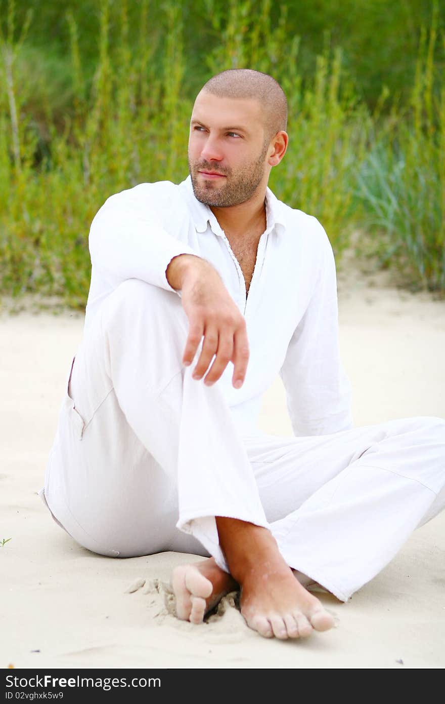 Attractive and happy man on beach