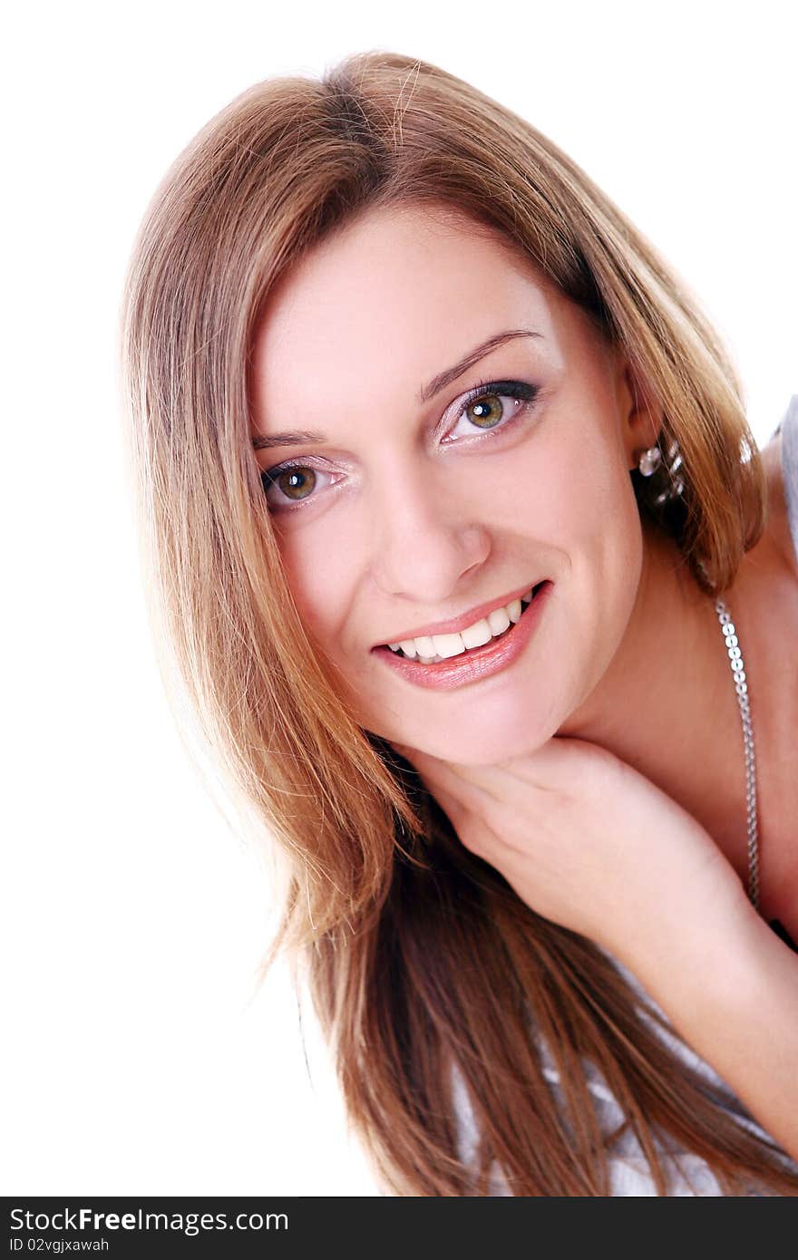 Closeup portrait of cute young girl smiling against white background