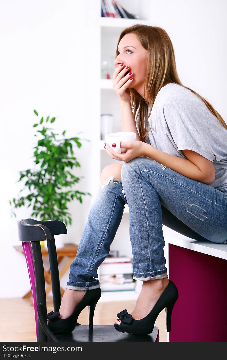 Happy beautiful woman relaxing at home. Happy beautiful woman relaxing at home