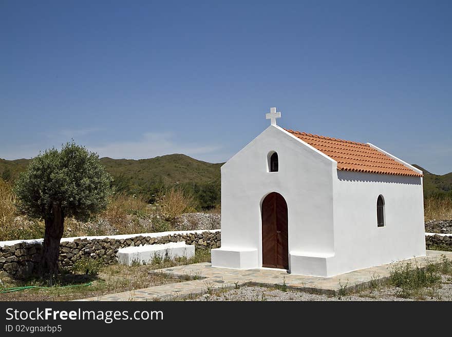 Traditional white greek chapel in Rhodes Greece